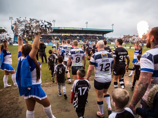 Featherstone Rovers players and cheerleaders