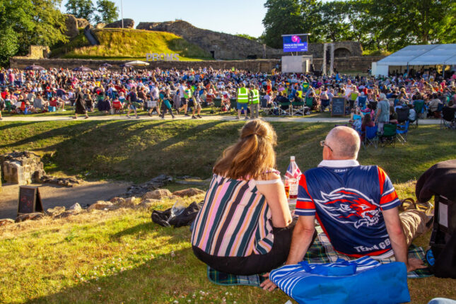 An image of a couple having a picnic during Proms at the Castle.