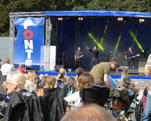 A band performing on stage at Ponte Rocks